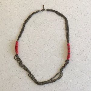 Red beaded brass colored necklace